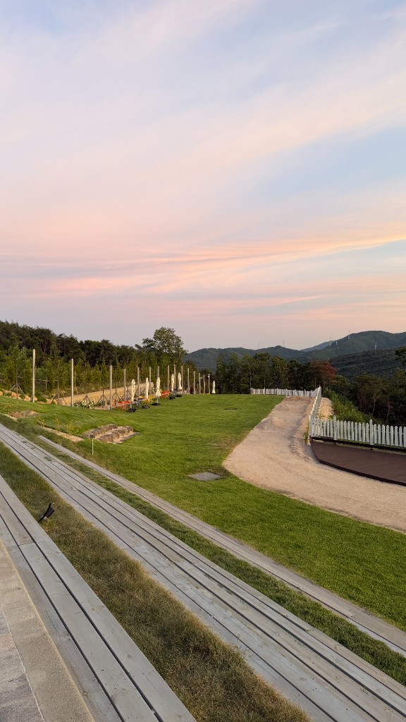 Sunset view from Dayul Soop cafe terrace overlooking forested hills
