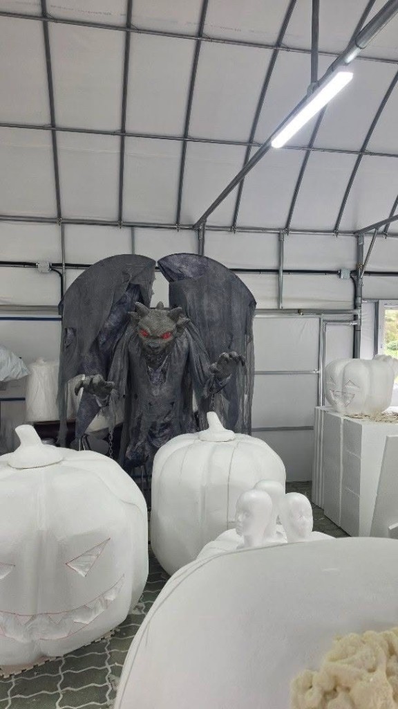 Halloween gargoyle prop with white foam pumpkins