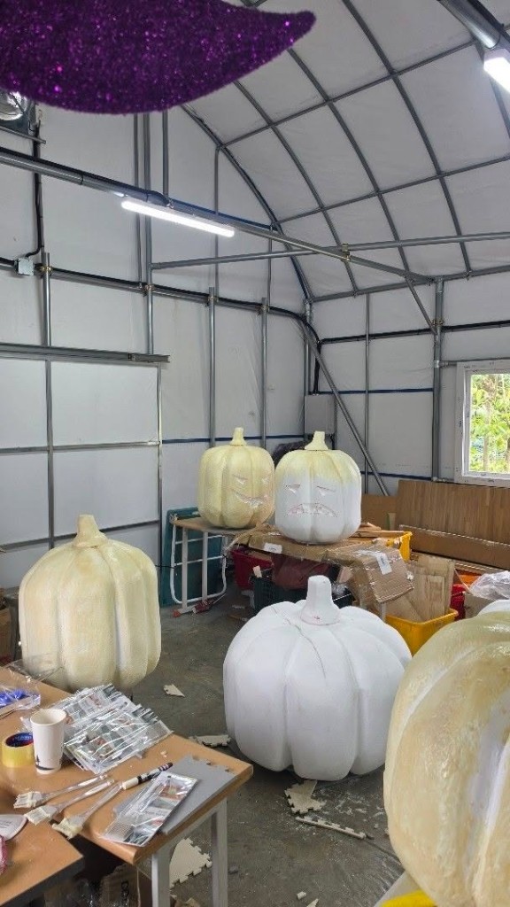 Workshop with carved foam jack-o-lantern pumpkins