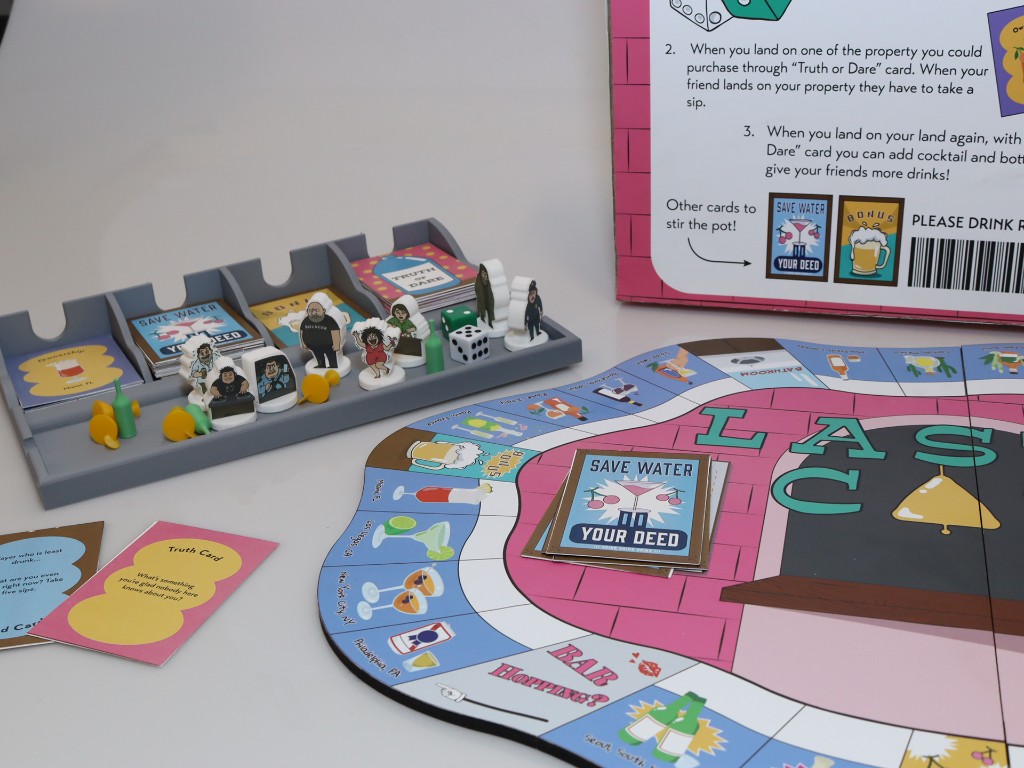 Last Call game set — board, cards, character pieces, dice, and organizer tray