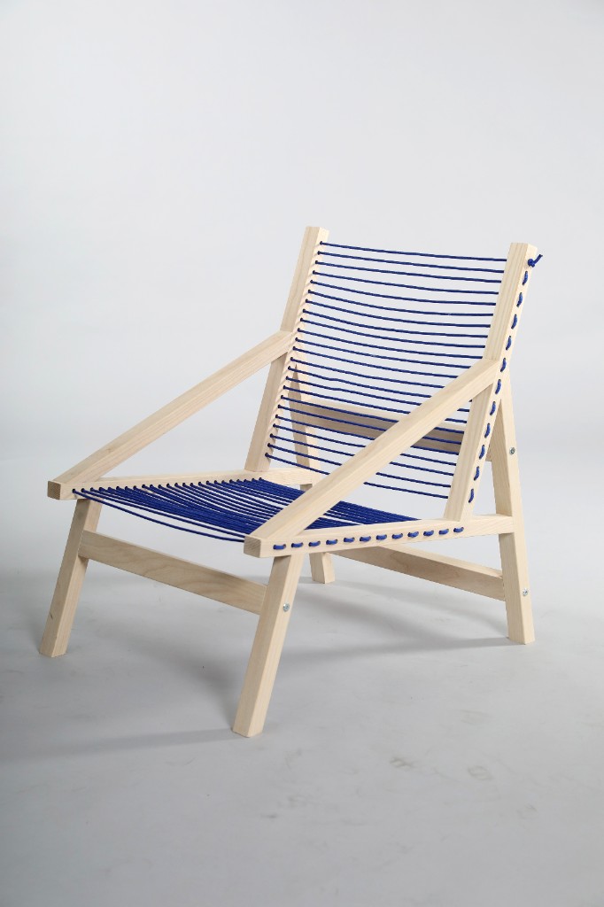 Minimalist lounge chair — light wood frame with blue cord seat and backrest