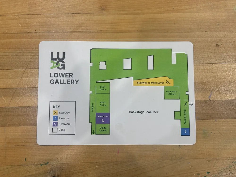 Printed LUAG Lower Gallery map on wood surface