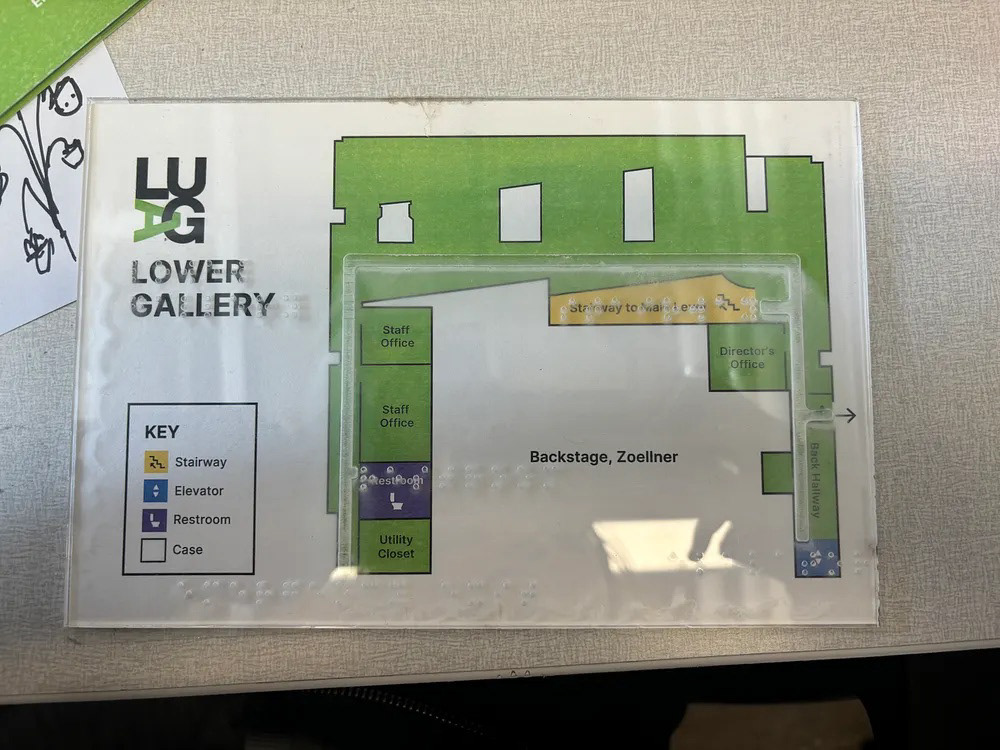Physical LUAG Lower Gallery map with clear Braille and tactile path overlay