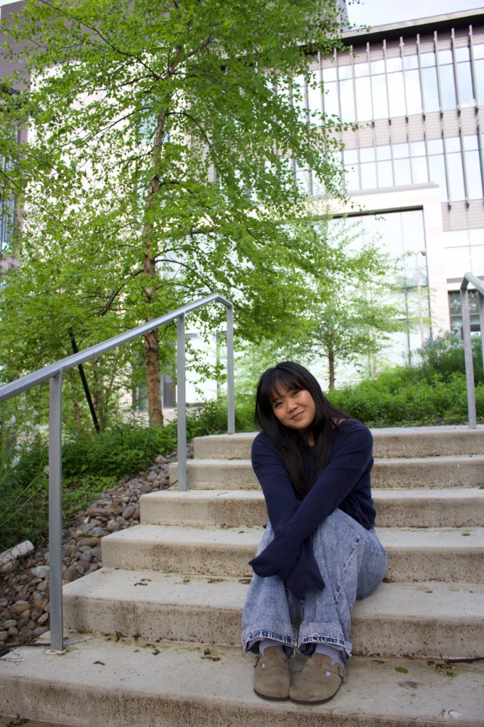 Person sitting on outdoor concrete stairs