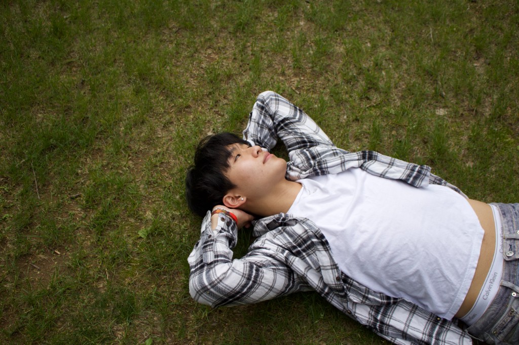 Person lying in the grass looking up