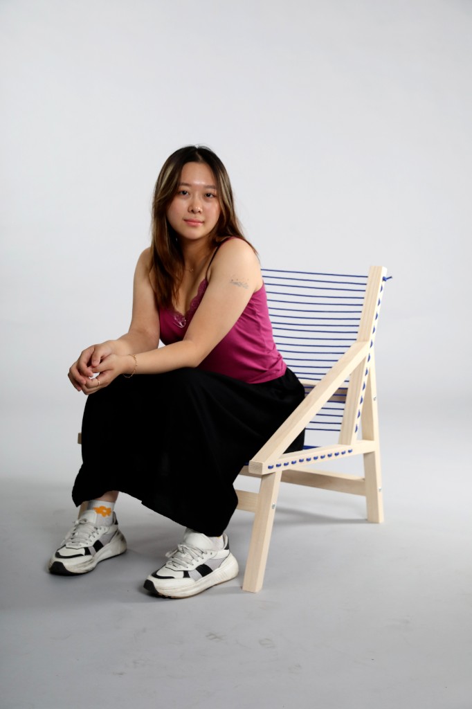 Person seated in the finished Tricoard Chair